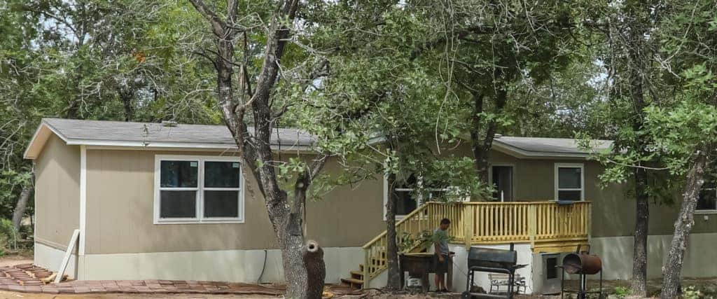 New Mobile Home behind trees