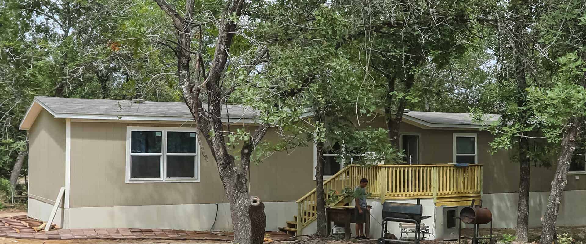 New Mobile Home behind trees