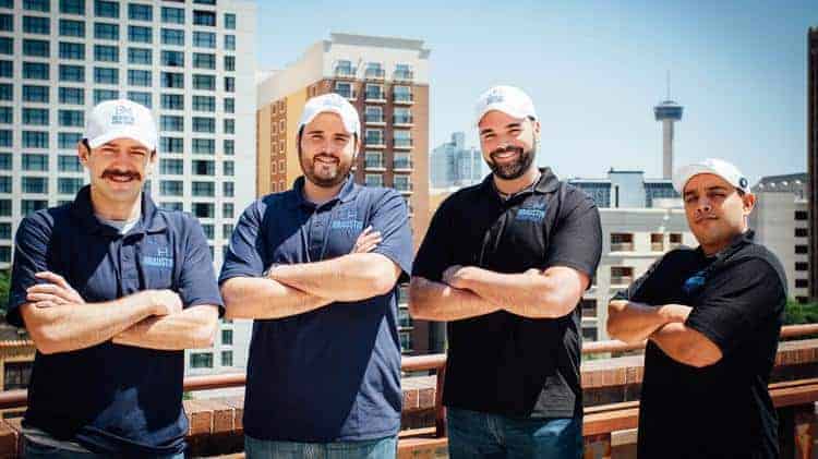 Four members of the Braustin Homes team