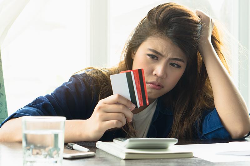 girl holding her cards