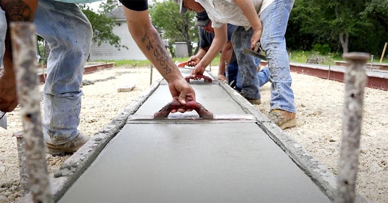 concrete being leveled for a mobile home foundation