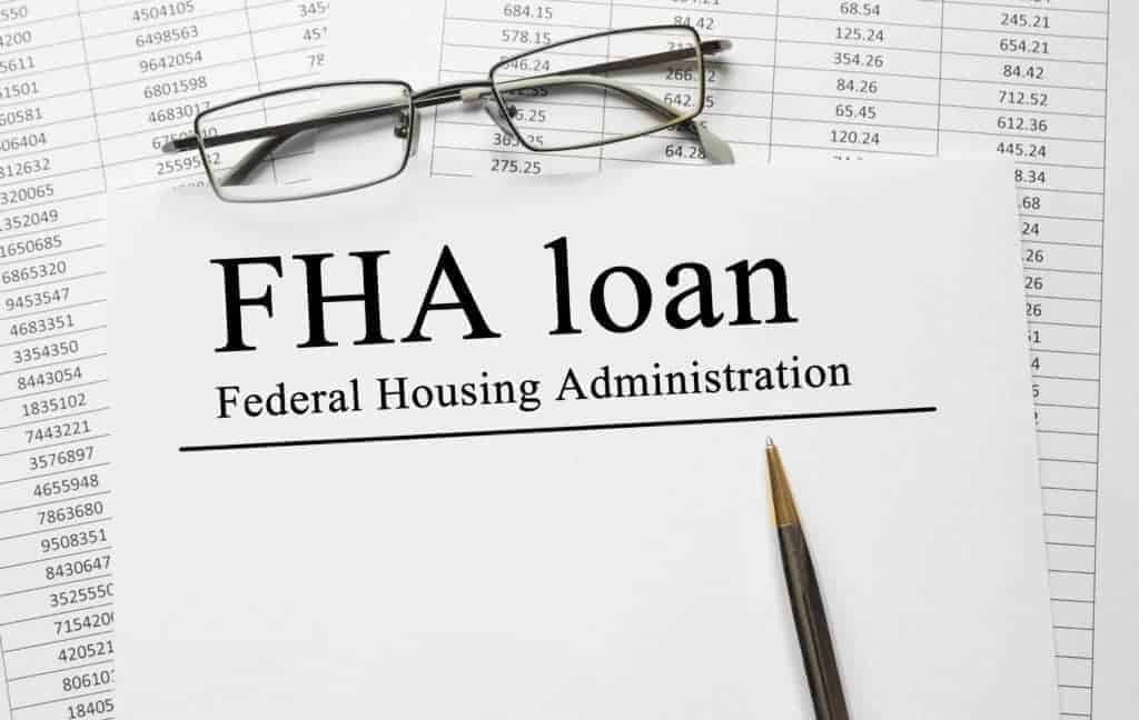 Paper with FHA loan on a table