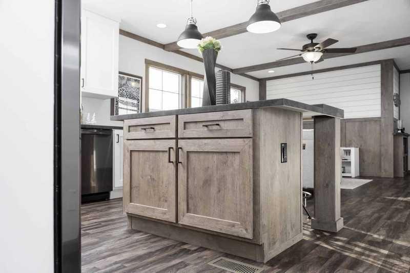 Image showcasing cabinet island with vinyl flooring