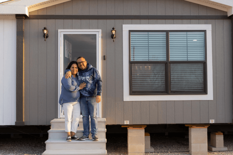 Sanchez family at the entrance of their mobile home