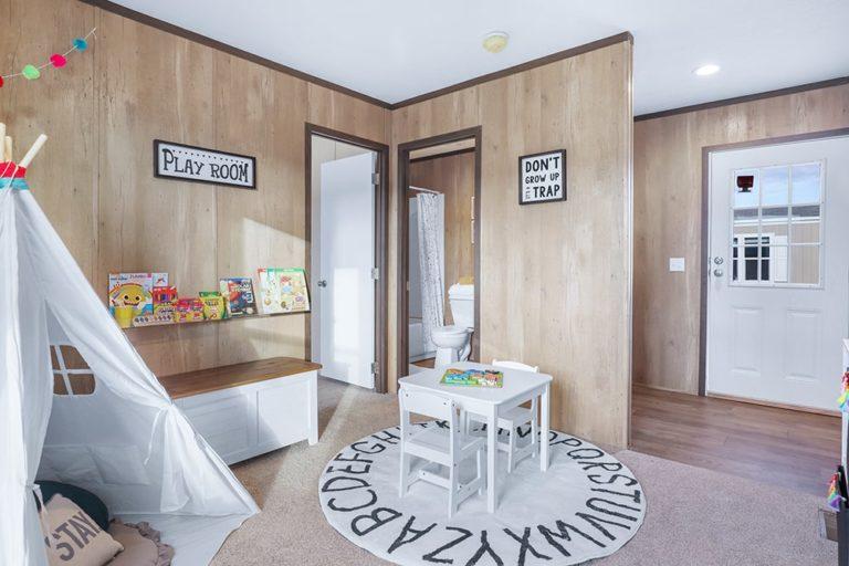 mobile home flex room being used as children's play room.