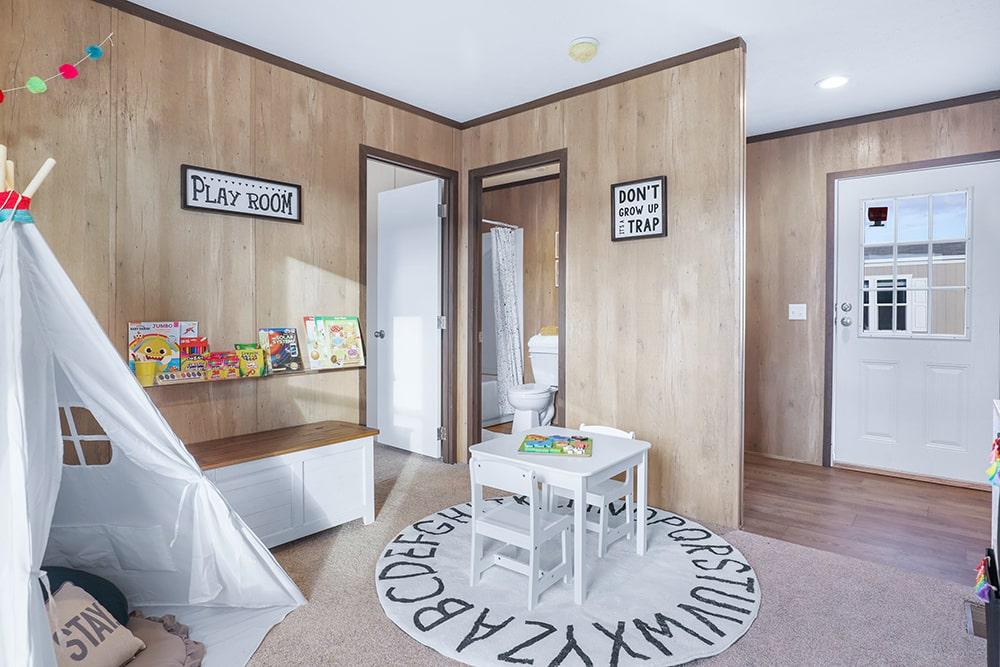 mobile home flex room being used as children's play room.