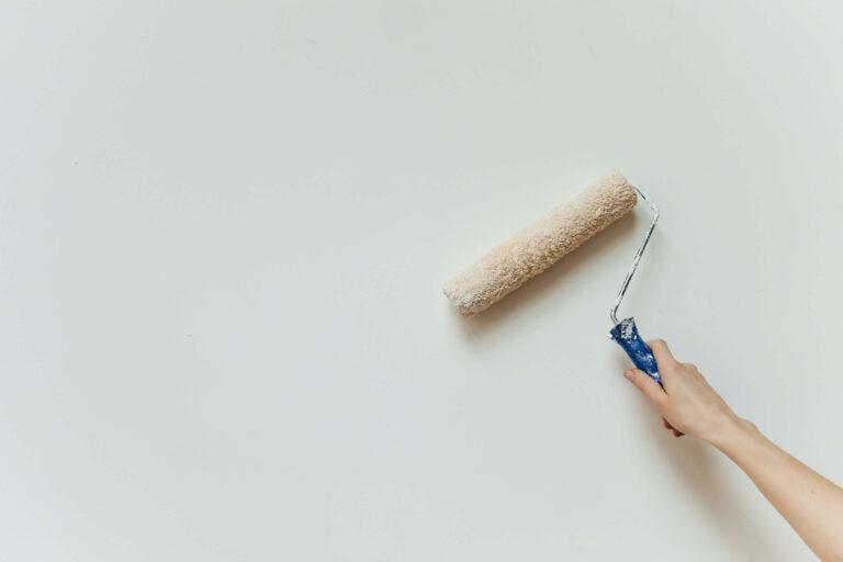 Painting mobile home walls with a roller