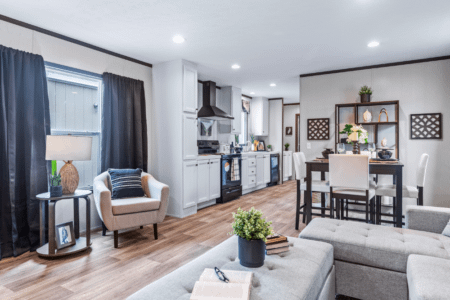 Clayton Homes Bonham Series Desire Single Wide Manufactured Home Interior Living Room and Dining Area with Large Window