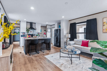 Clayton Homes Bonham Series Intuition Single Wide Manufactured Home Interior Kitchen and Living Room with Large Window