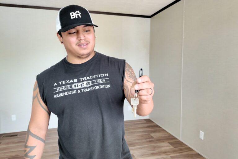 Homeowner holding the keys to his new home